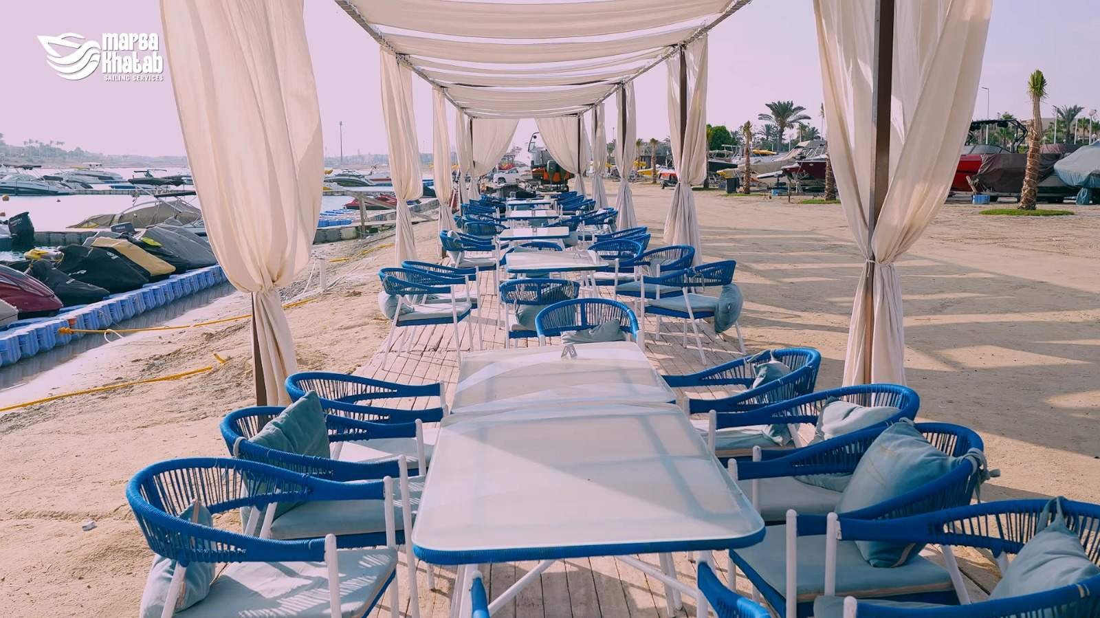 Long row of elegant lounge seating along the Marsa Khatab boardwalk
