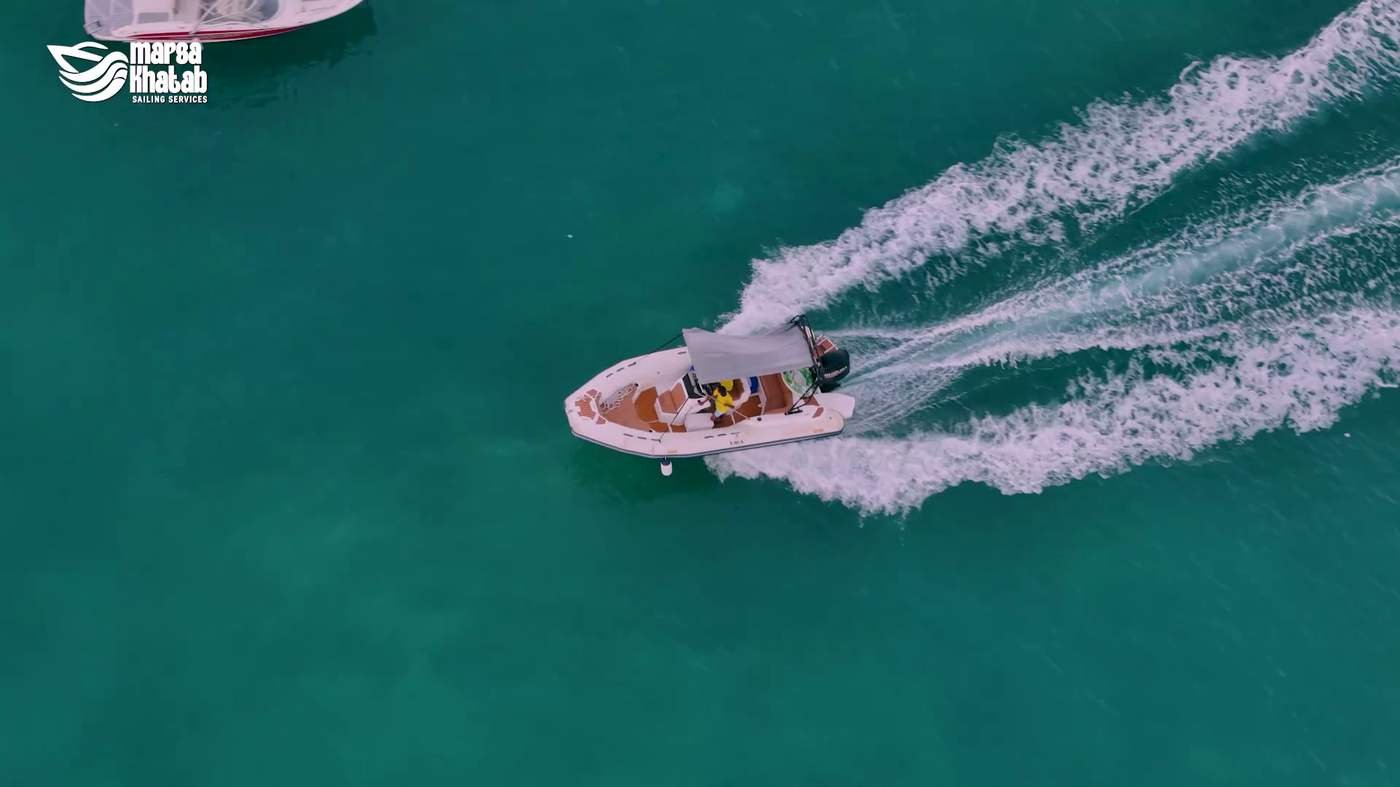 Speedboat leaving a wake trail across the marina waters